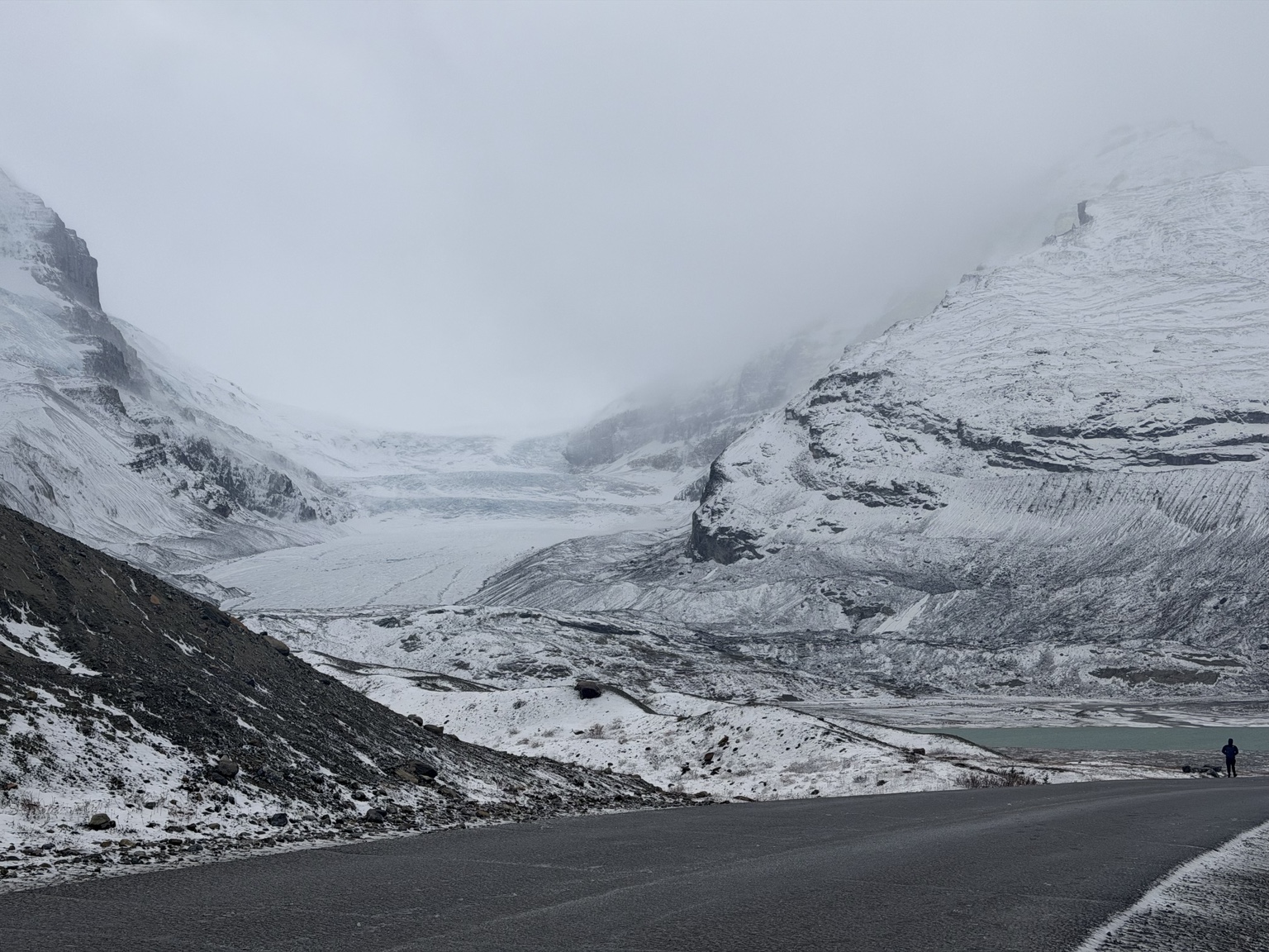 Athabasca Glacier beneath snow-covered peaks